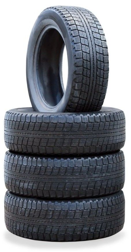 The stack of four winter new tires over white stack of tires